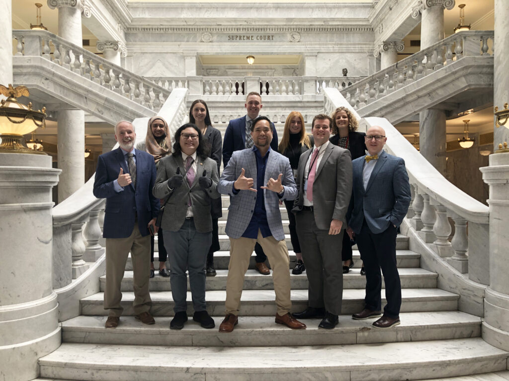 AGO interns posing on Capitol steps with Executive Team.